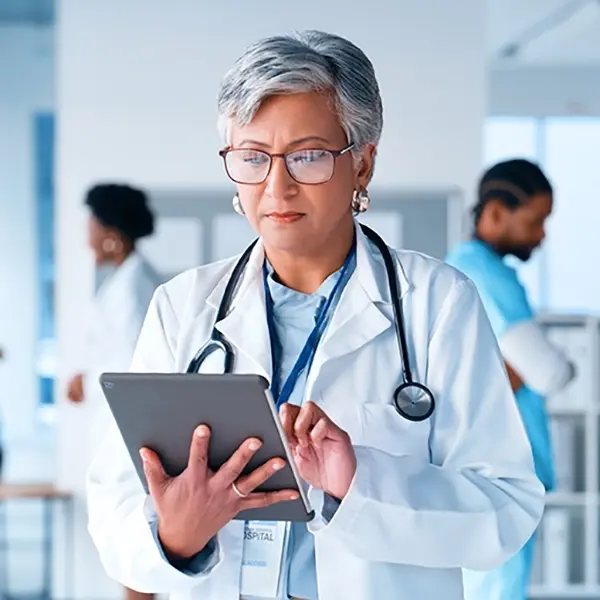 Physician looking at computer